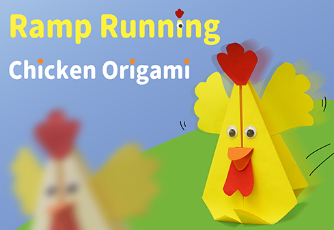 An origami chicken, made of bright yellow paper, takes center stage. It has a red comb and wattle, googly eyes, and a small orange beak. Its wings are slightly spread, and two black lines trailing behind give the impression of movement. Another similar origami chicken, blurred, appears in the background to the left. The text Ramp Running and Chicken Origami are positioned above the chicken in yellow and white respectively, against a light blue background. A green, slightly hilly landscape lies beneath the chicken.
