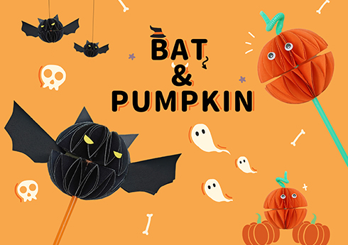 Against a vibrant orange backdrop, various Halloween-themed paper crafts are displayed. These include bats, pumpkins, and ghosts. Some of the bats and pumpkins are designed as lollipops, featuring folded paper bodies attached to sticks. The scene is further embellished with small skull and bone motifs, enhancing the festive atmosphere. The words BAT & PUMPKIN are prominently displayed, emphasizing the Halloween theme.